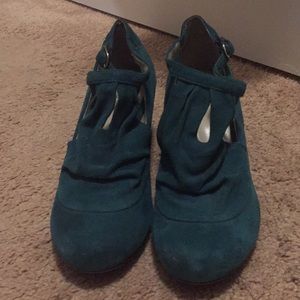 Turquoise faux suede cone heel pumps.